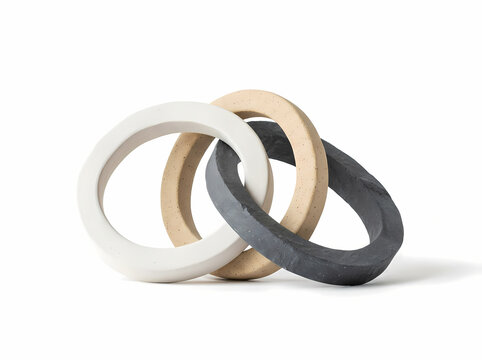 Three interlocking stone rings in white beige and dark grey