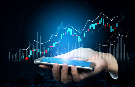 A close-up image of a hand holding a smartphone displaying stock market data, illustrating the intersection of technology and finance in today digital age. Scalp