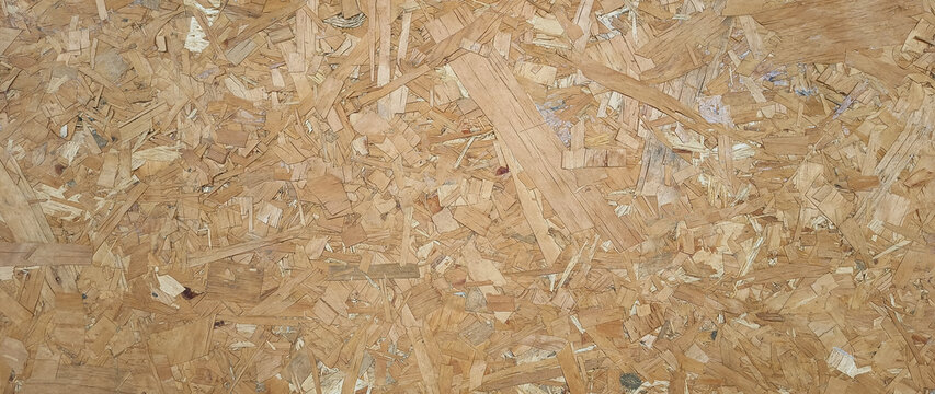 Wooden background. OSB boards made of brown wood chips sanded into wooden background, Wood plank texture background, surface texture of oriented board OSB. not ai