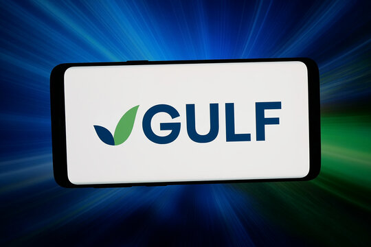 Stuttgart, Germany - 06-15-2026: In this photo illustration, the logo of Thai company Gulf Energy Development pcl is displayed on a smartphone in front of abstract background on computer screen.