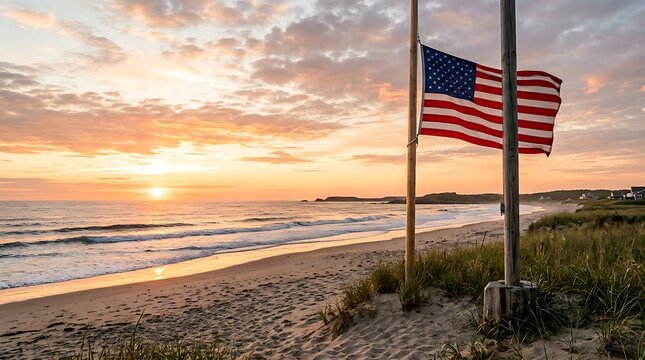 American flag waving proudly on a sandy beach at sunset