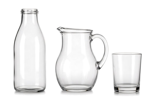 Collection of empty clear glass drinking vessels including a tall bottle a rounded pitcher and a short tumbler cup&nbsp;