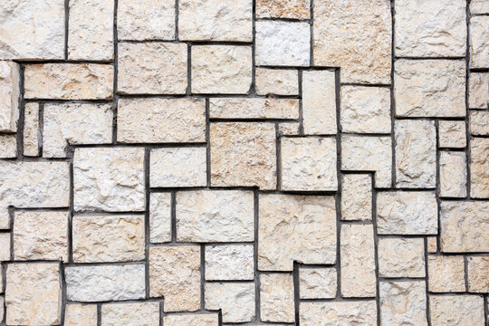 Light stone tile facade texture background