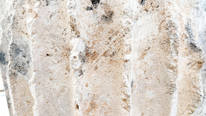 Obraz premium ured limestone wall in natural light with warm beige tones suitable for architectural backgrounds, texture overlays, editorial and product mockups, 5 May 2026 Subitica, Serbia