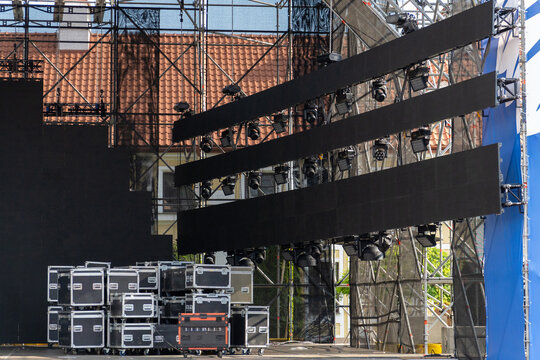 Outdoor concert stage setup with large LED video screens