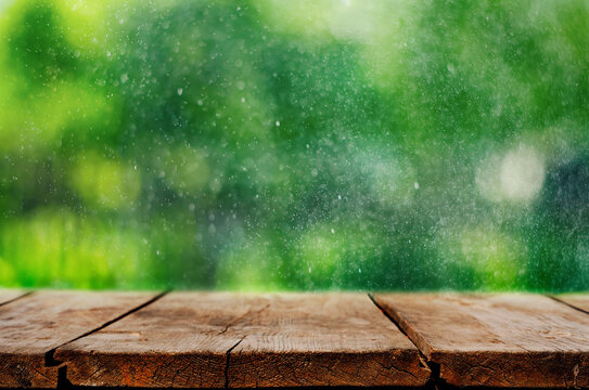 Wooden Table with Outdoor Bokeh Background