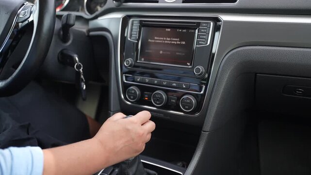 Woman Shifting Car Into Reverse Gear Activating Rear View Camera
