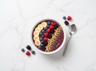 Overhead flat lay of a plain white ceramic bowl filled with a vibrant acai smoothie topped with sliced banana, mixed berries, granola, and chia seeds. © Em