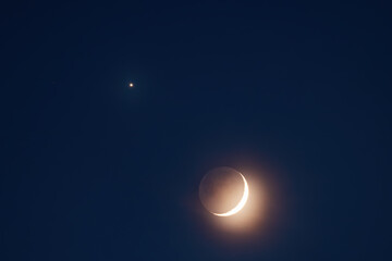 Crescent moon with planet shining in the dark blue night sky in Punta Cana Dominican republic © ValentinValkov