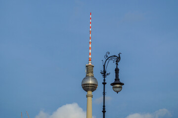 Berlin TV Tower Fernsehturm Against Blue Sky with Ornate Lamppost © Martin