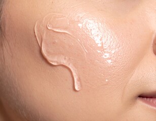 Fototapeta premium Clear Cosmetic Gel Smear on Human Skin Close-Up Skincare Application Concept