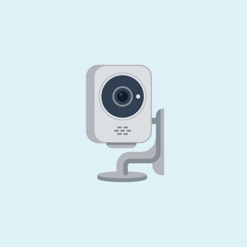 A modern white security camera mounted on a plain wall surface