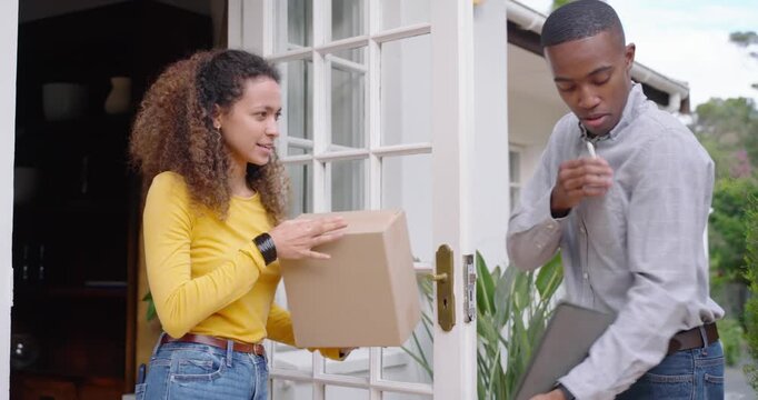 Courier, owner courier arriving at door with box tablet pen her tapping signing confirming delivery
