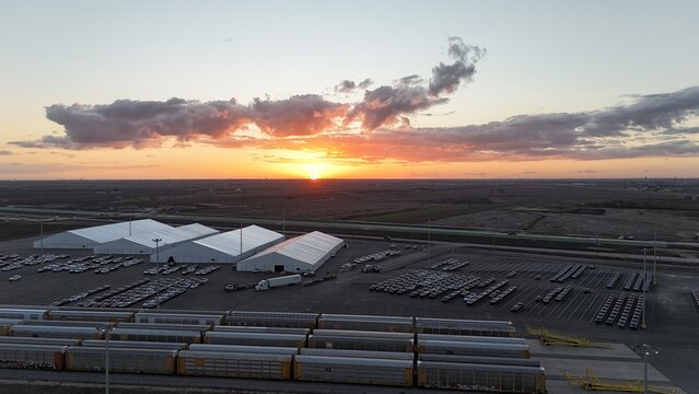 Sunset at industrial railyard