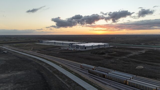 Sunset over industrial railroad park