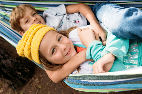 Kids hugging in hammock