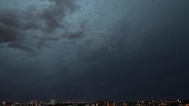 night thunderstorm over landscape aerial drone view, dramatic night thunderstorm with lightning in dark sky captured from drone. aerial view of storm clouds, severe weather and atmospheric landscape, 