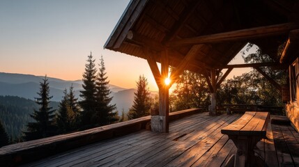 Fototapeta premium Serene Mountain Cabin at Sunset with Warm Sunlight and Wooden Deck Surrounded by Lush Pine Trees and Majestic Mountain Peaks in the Background