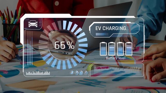 A modern office scene featuring a digital display showing electric vehicle charging status. Team members collaborate on sustainable solutions and innovative ideas in a dynamic workspace. Raster