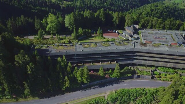 Aerial view flying away from the abandoned hotel monte palace in sete cidades, sao miguel island