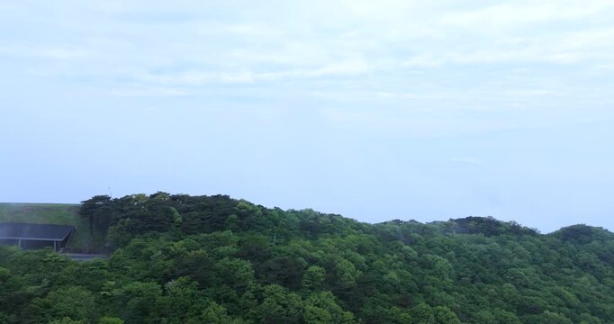 seongjusan, boryeong, south korea, aerial view, drone shot, hyperlapse, timelapse, mountain fog, mist, misty morning, cloudy sky, fast motion, atmospheric, majestic nature, serene landscape, pine tree