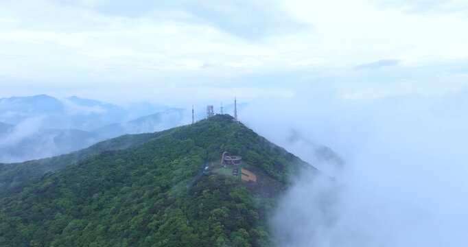 seongjusan, boryeong, south korea, aerial view, drone shot, hyperlapse, timelapse, mountain fog, mist, misty morning, cloudy sky, fast motion, atmospheric, majestic nature, serene landscape, pine tree