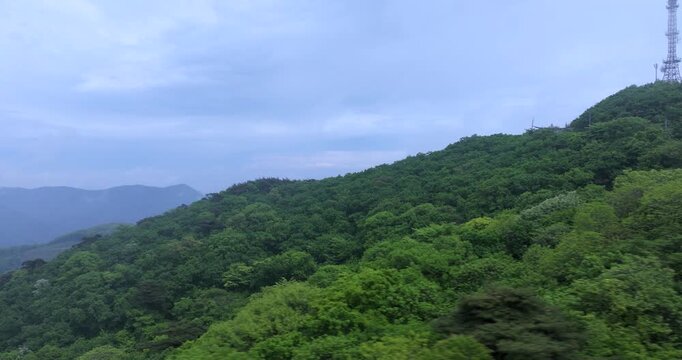 seongjusan, boryeong, south korea, aerial view, drone shot, hyperlapse, timelapse, mountain fog, mist, misty morning, cloudy sky, fast motion, atmospheric, majestic nature, serene landscape, pine tree