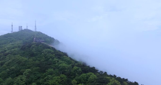 seongjusan, boryeong, south korea, aerial view, drone shot, hyperlapse, timelapse, mountain fog, mist, misty morning, cloudy sky, fast motion, atmospheric, majestic nature, serene landscape, pine tree