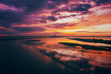 Fototapeta premium Aerial view of Mobile Bay at sunset