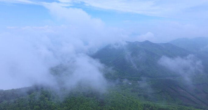 seongjusan, boryeong, south korea, aerial view, drone shot, hyperlapse, timelapse, mountain fog, mist, misty morning, cloudy sky, fast motion, atmospheric, majestic nature, serene landscape, pine tree