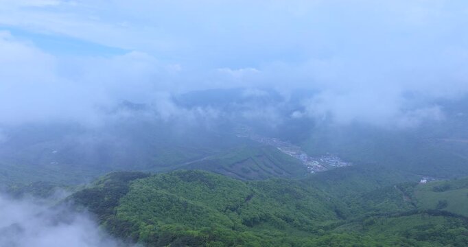 seongjusan, boryeong, south korea, aerial view, drone shot, hyperlapse, timelapse, mountain fog, mist, misty morning, cloudy sky, fast motion, atmospheric, majestic nature, serene landscape, pine tree