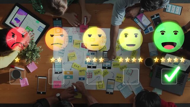 Engaged team brainstorming user experience ideas on a table filled with drawings, notes, and digital devices, showcasing collaboration and creativity in design processes. Raster