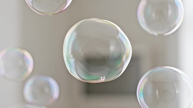 Abstract close up of bubbles floating on a light grey surface