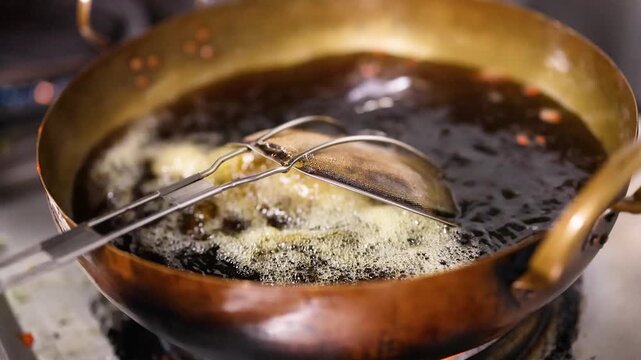 Chef Frying Indian Street Food in a Brass Kadai Wok