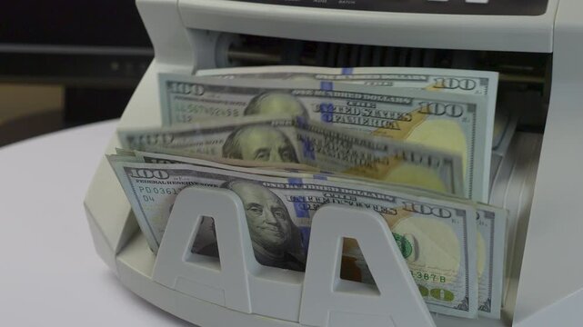 Money Counter Machine Processing US 100 Dollar Bills in Office, jib studio shot