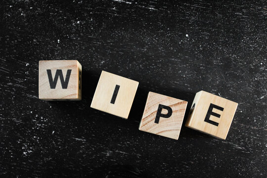 Wooden Block words on black background.