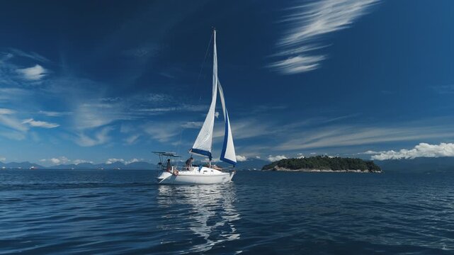 Aerial view of the sailing boat sailing in the sea near the islands close to the town of Paraty and Angra dos Reis in Brazil