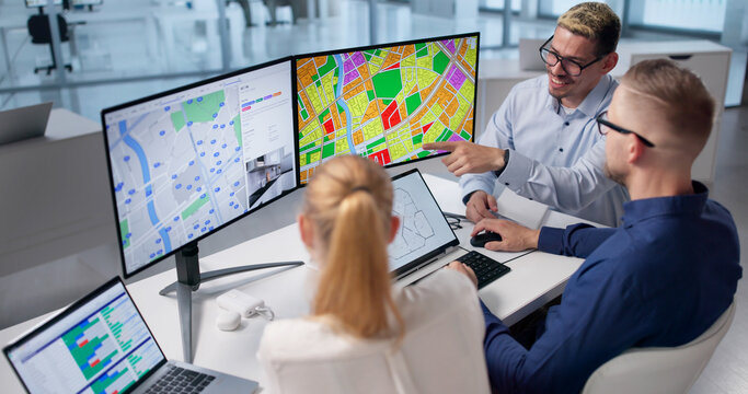 Urban Planners Study Zoning Maps