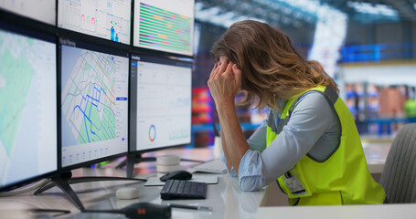 Tired Warehouse Worker Looks Sad While Staring