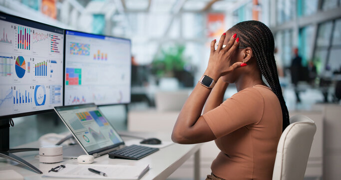 Stressed Woman Looks Tired And Overwhelmed While