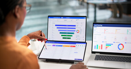 Fototapeta premium Young Marketing Manager Studies Sales Funnel Data