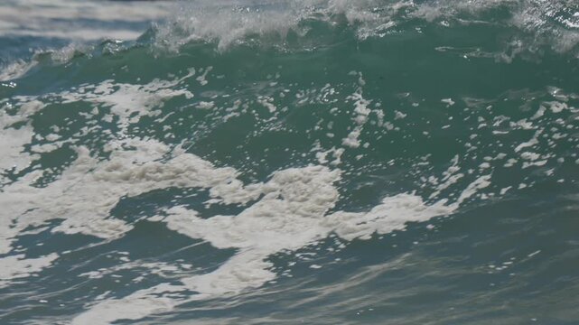 Giant shorebreak waves crashing at the wedge