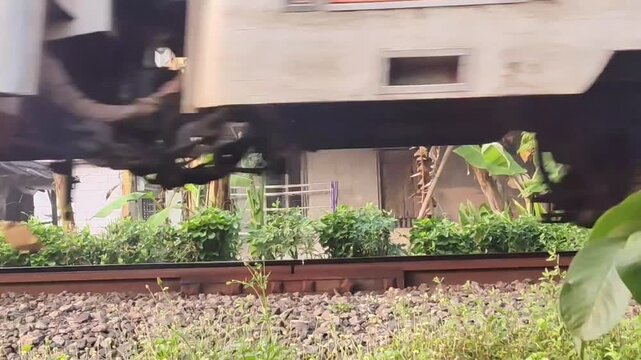Close Up of Railway Bogie Rolling on Steel Tracks