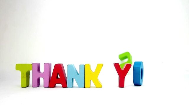 THE wors THANK YOU with painted wooden letters 