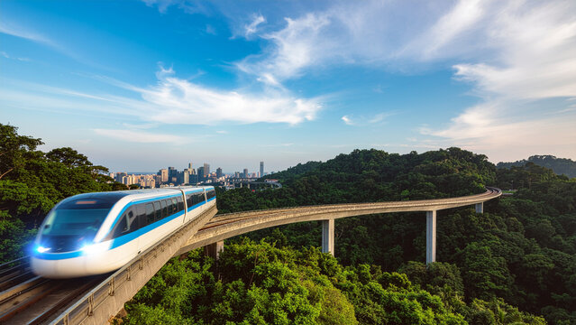 Modern passenger train traveling on scenic elevated track through lush forest toward city skyline