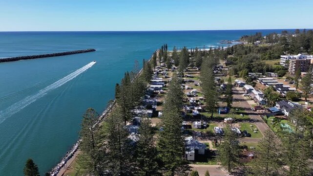 Aerial view Port Macquarie Victoria Australia. Urban landscape on the shores of the Southern Ocean with beaches and boats floating in the ocean.