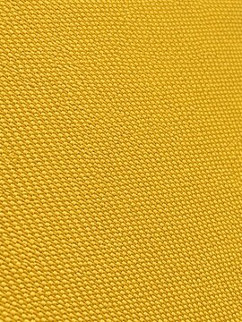 Bright yellow woven fabric texture close up background