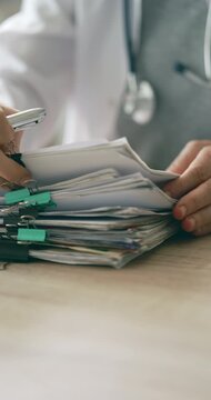 Medical doctor completing administrative healthcare records