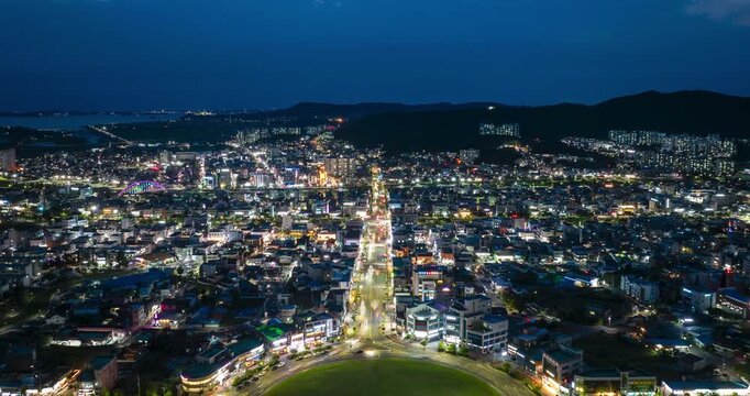Aerial hyperlapse of Boryeong city roundabout from sunset to night, South Korea