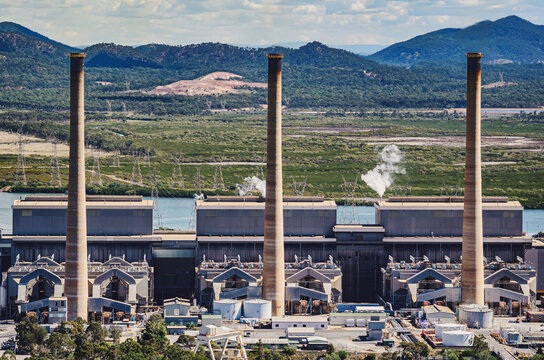Three tall smokestacks rising from coal fired power station